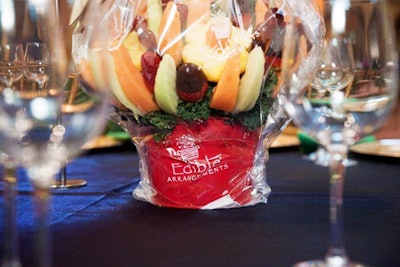 Edible Arrangements donated centerpieces mixing pineapple, strawberries, cantelope, and honeydew melon.