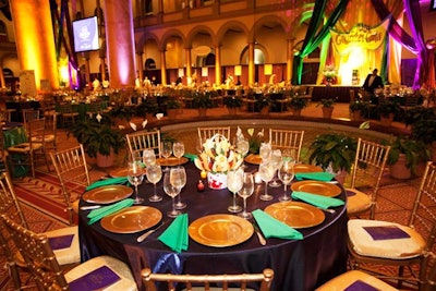 The table linens alternated purple and green accented by gold chairs.