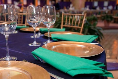 Gold chairs accented the Mardi Gras-colored linens.