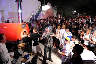 Guy Fieri made pizzas in a brick oven at the festival's closing night party at the 55,000-square-foot Gansevoort Beach Club.