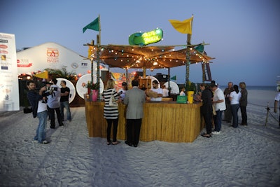 Havaianas set up tiki bar outside the Burger Bash tent, where Iron Chef Marc Forgione prepared Brazilian-inspired drinks, appetizers, entrees, and desserts. Guests who visited the booth took home a pair of Havaianas.