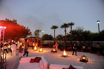 Fire pits and white couches topped the sand at the festival's closing party.