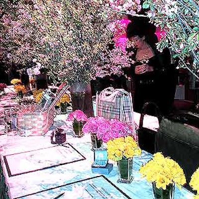 The silent auction area was laden with tall arrangements of cherry and crab apple blossom branches and single-type flower bouquets.