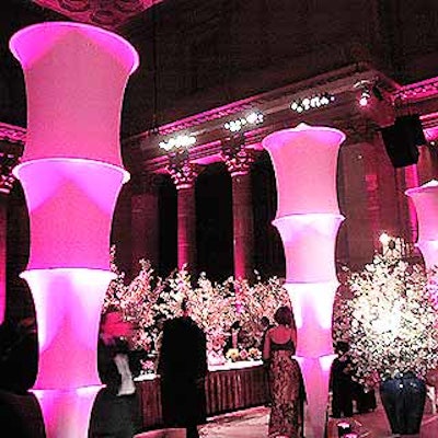 Pink-lit fabric columns from Pink Inc. divided the ballroom between the cocktail and silent auction area and the dining area.