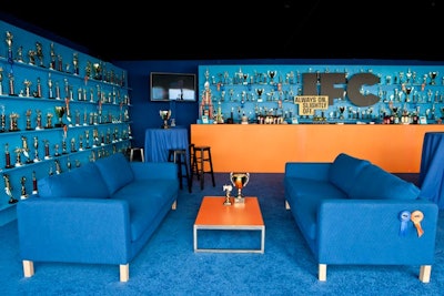 IFC's space, created by David Stark Design and Production in concert with IFC's Lauren Burack, resembled a sports bar decked out in the cable network's colors of blue and orange.