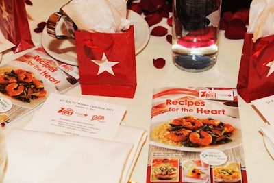 Heart-healthy recipe books and miniature Macy's bags filled with $10 gift cards sat at each place setting.