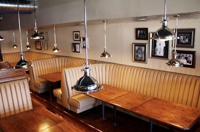 Black and white photographs of the restaurant namesake's time in the U.S. Navy, as well as those of aircraft carriers, line the walls of the dining areas.