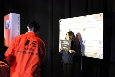 Like the step-and-repeat for cast and A&E execs, the backdrop for the photo booth played up mugshot-style height charts. Letter board props imprinted with 'A&E State Penitentiary' helped complete the picture.