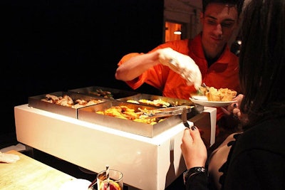 As a playful take on stereotypical jail canteens, one food station doled out bites from an open chafing dish.