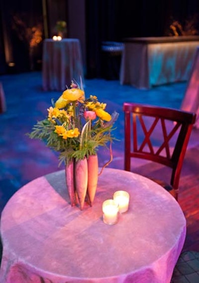 In the reception area, cocktail tables bore suede linens and springy flowers in wooden bud vases.
