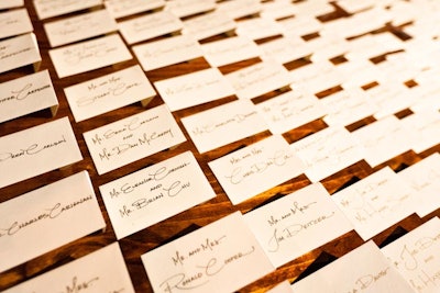 Simple place cards combined ivory paper stock with gold writing.