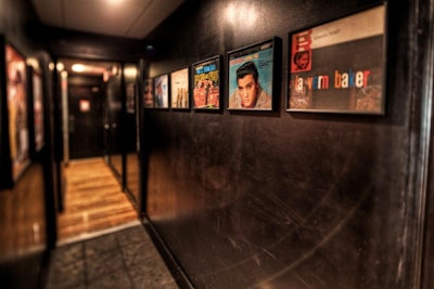 Posters of Elvis and other 1960s icons underscore the retro vibe.