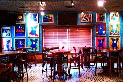 The casual spot has walls filled with colorful artwork.