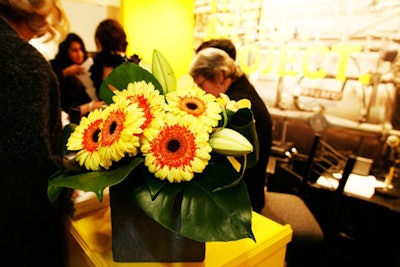 Yellow flowers and bowls of lemons accented the space while fitting into the theme.
