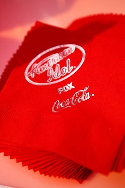 Logos decorated red cocktail napkins.