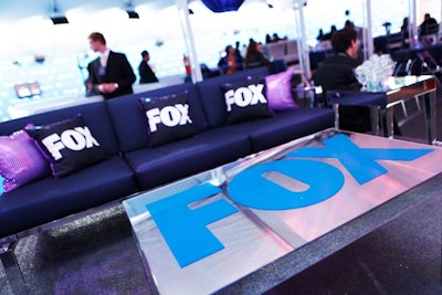 Fox logos decked a tabletop and throw pillows.