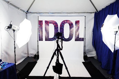 The word 'idol' decorated a backdrop for photos.