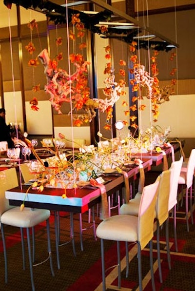 MGM Resorts Events won the popular vote and the 'greatest level of difficulty' category. The design included two suspended tables floating from the ballroom ceiling. Natural grapewood pieces were internally suspended with 300 orchids. The entire setting was a modern interpretation of an ancient Asian temple. The center was intended to represent a wind-blown field, with 200 salmon tulips and clear acrylic rods cascading up and over the structure.