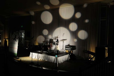 Bay Stage Lighting created a polka-dot backdrop for the entertainment from Phase5 Band.