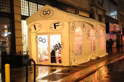 The event's production crew planned for Thursday night's rainstorm with an arrivals tent erected outside the Broadway entrance to the Opening Ceremony store at the Ace Hotel. Images in the style of vintage luggage labels decorated the structure.