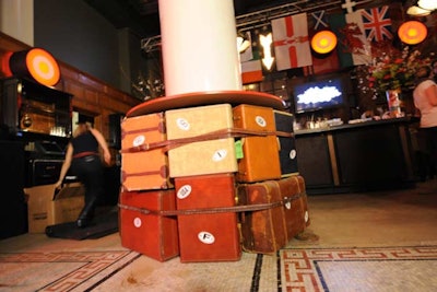 Around the lobby's interior columns, Extra! Extra! topped mounds of trunks, suitcases, and duffel bags with solid wood to create cocktail tables.