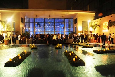 Guests gathered on the JW Marriott Marquis's pool deck, despite a strong breeze.