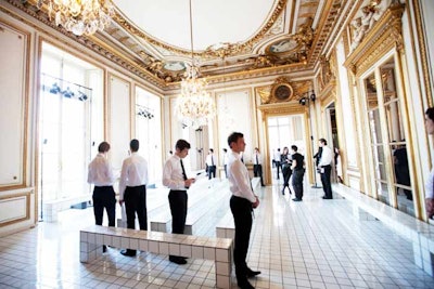 Having consistently shown at the Hôtel de Crillon's grand salon, Balenciaga returned to the gilded space and tiled the entire floor in white for Nicolas Ghesquière's fall/winter 2011 collection on March 3. The graphic, almost bathroomlike background even extended to seating for guests and served as an ideal contrast to the prints and controlled draping of the line.