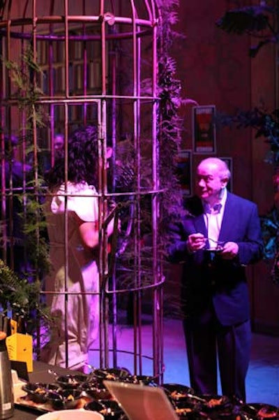 During the cocktail reception, a banjo-playing performer serenaded guests from inside a cage.
