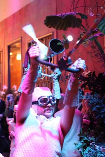 A crew of 'flying performers' acted as an abstract airplane, circulating with handlebars, horns, propellers, and goggles, and making 'whoosh' noises with their mouths.