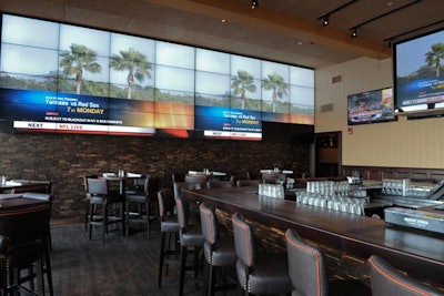 A 42-foot screen made up of 32 televisions takes up the venue's back wall.