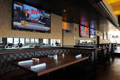 Seating includes tufted-leather booths for groups.