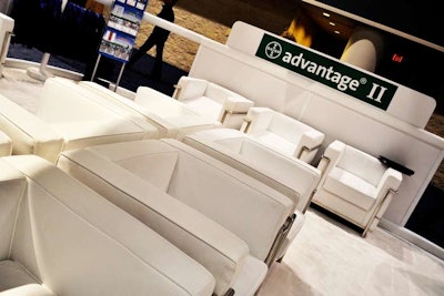 Bayer HealthCare placed more than a dozen white lounge chairs at its booth to invite attendees to sit and relax.