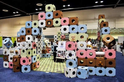 Catty Stacks incorporated its product—cardboard boxes that create custom play areas for cats—into the design of its booth.