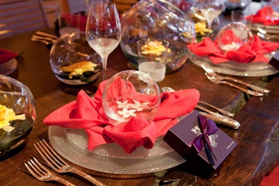 Coffinier Ku Design topped two tables with big glass bowls full of floating gardenias in the New York Design Center's setting, which was a tribute to Christian Bérard.