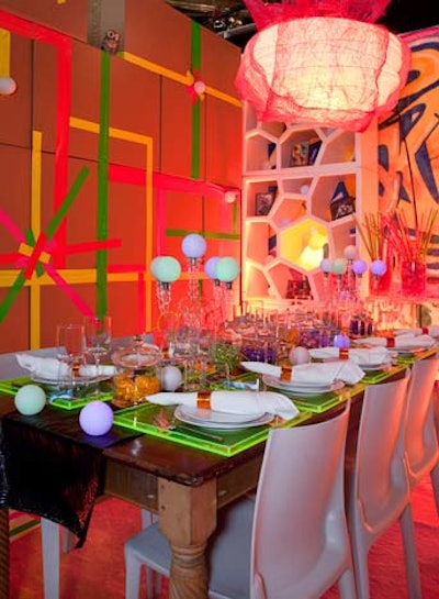 For sponsor Susan Blond, Jes Gordon created a fun, bold look using a variety of inexpensive materials such as cardboard boxes, neon masking tape, round LED lights, and Styrofoam shelving.