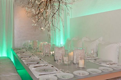 Scandia Home used hidden color-changing lights to enliven its all-white space. Soft cotton pillows and glass containers full of cotton created a cozy look. Plain white dinner plates featured the company's logo�'an easy branding idea.