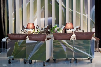 Marc Blackwell's elegant setting had one row of plush banquette seating and one row of custom-made chairs on casters. When arranged in a row, the chair backs formed an abstract image.