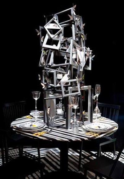 Caroline McKeough created a small four-seat table with a tall centerpiece made out of dozens of overlapping picture frames. Small metal butterflies added a touch of sparkle.