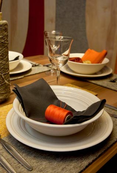 2Michaels turned sponsor Flor's floor tiles into place mats. Spools of thread tied in the textile theme and served as napkin rings.