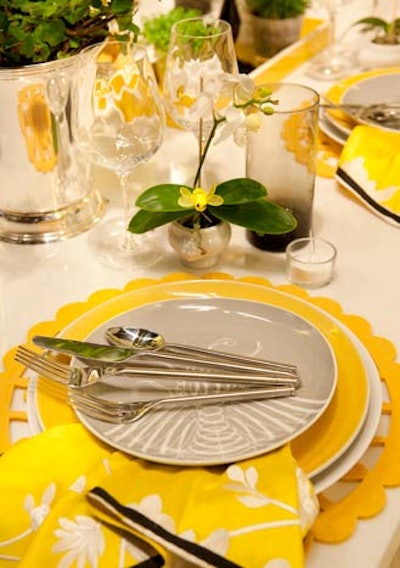 Michael Tavano used several patterned plates and a fabric place mat, and incorporated an offset folded napkin into each place setting.