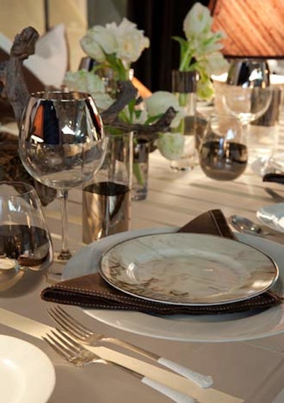 Marc Blackwell's brown and white place setting included paint-dipped flatware (a big trend at Diffa), as well as silver-edged glassware.