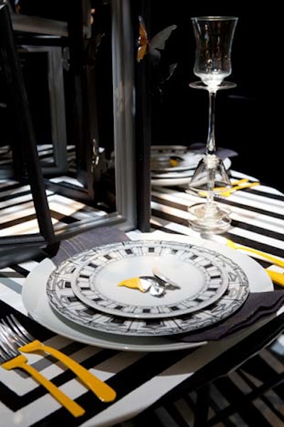 Paint-dipped flatware appeared at Caroline McKeough's table, as well as tall, glued-together glassware and black-and-white patterned plates.