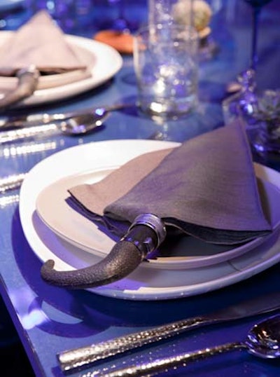 Evette Rios's table evoked a rainy dinner on a covered patio. Rain-themed touches included napkins folded around umbrella handles.