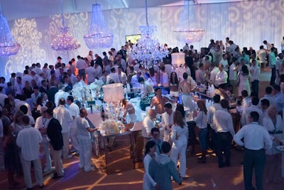 With glittering chandeliers overhead, guests got into the spirit of the white party with their wardrobe.