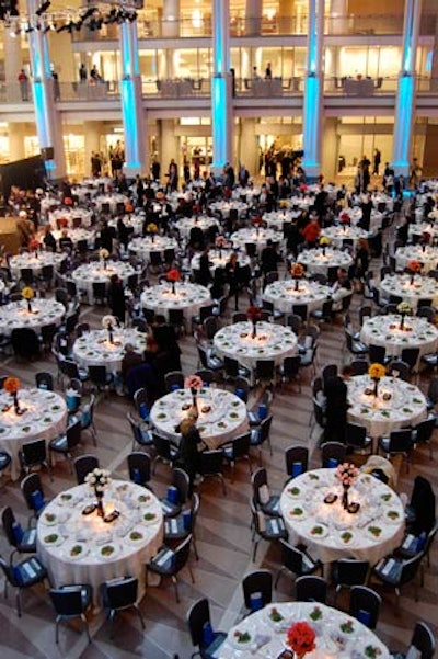 Dinner tables filled the main floor and surrounding balconies of the venue's atrium.