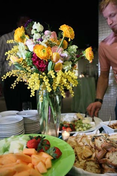 Well Dunn Catering set up stations throughout the reception area stocked with cheese, fruit, and crackers.