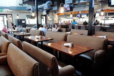 Brick House has seating for more than 300 people on the patio, at the bar, and at tables flanked by sofas.