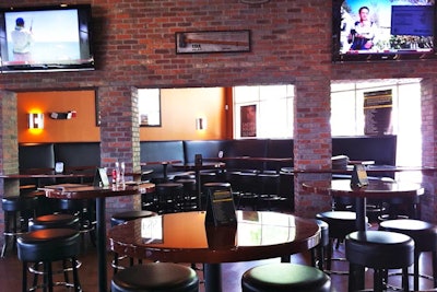 World of Beer has seating at high-top tables, leather booths, and a long bar.