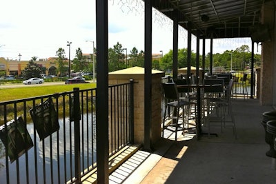 The patio at World of Beer has seating at high-top tables and five TVs for sports viewing.