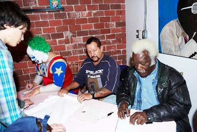 Wrestlers signed autographs during the V.I.P. hour.